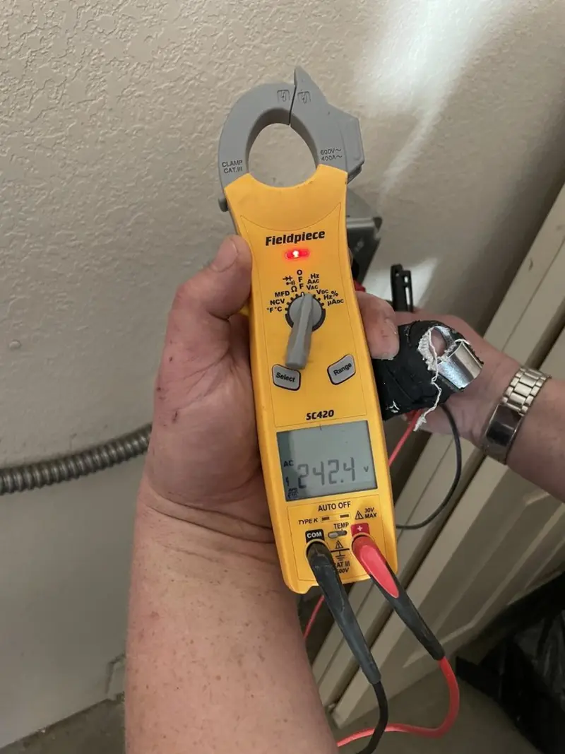 Voltage testing with clamp meter during Outlet Installation in Shannon Hills